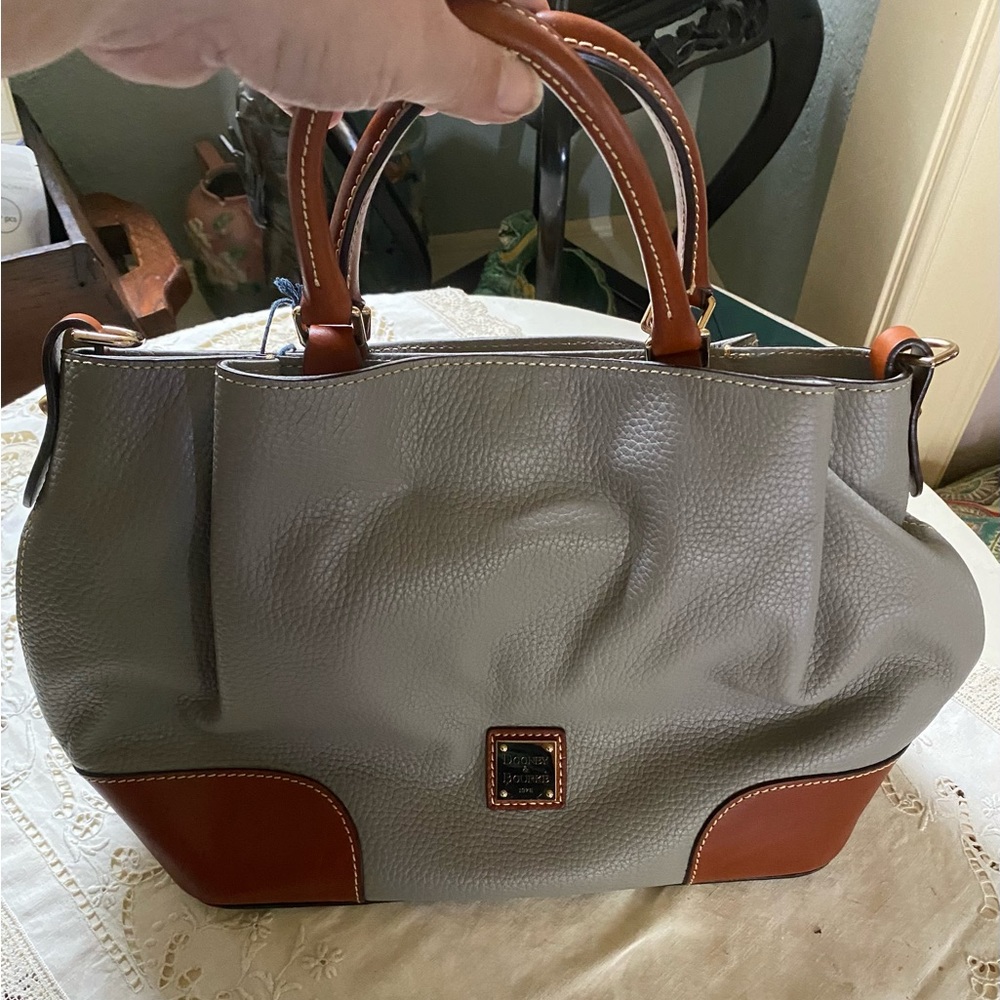 Dooney & Bourke Bag New With Tags. Perfect Condition. All Leather. Color Smoke.